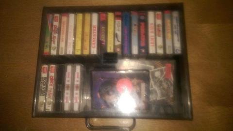 24 Commodore 64/128 games in a carry case. OK Condition
