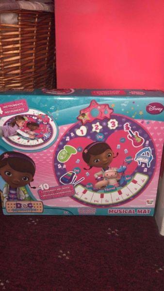 dc.mcstuffins musical play mat 20 euro