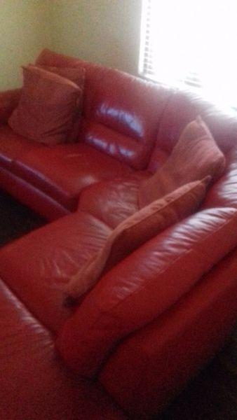 Red leather sofa 4 yrs old for sale
