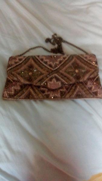 Gold clutch bag with long chain...intricate beading and detail