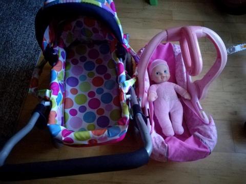 Pram, baby doll and car seat