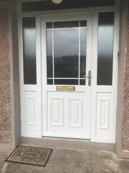 PVC white front panel door with two side lights and a toplight