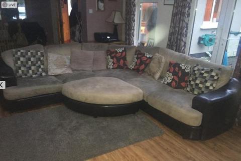 Large L-shaped sofa with footrest