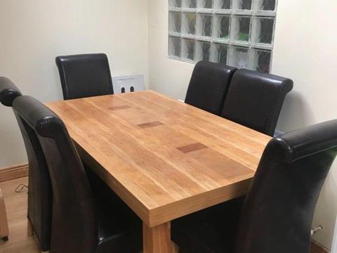 Dining room table and 6 brown leather chairs