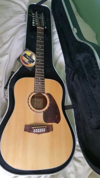 12 string Yamaha acoustic guitar in hard case