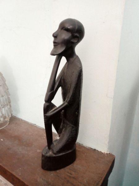 Old black wood Jamaican figure