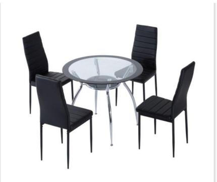 Glass table nad chairs . Brand new