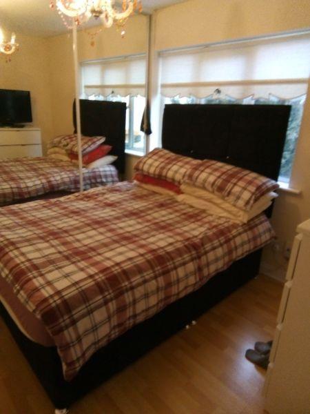 Double bed black headboard and mattress