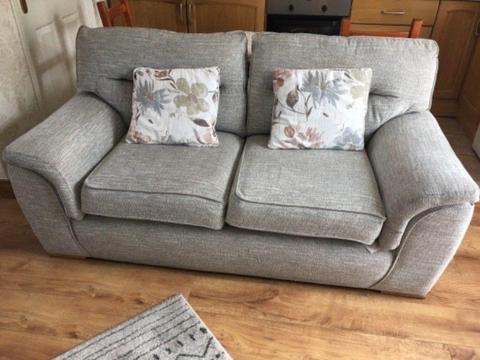 Large sofa and single swivel chair . Grey