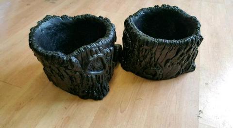 Two tree stump plant pots