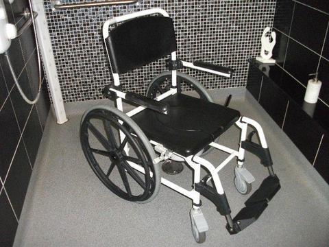 Shower/commode self propelled wheelchair