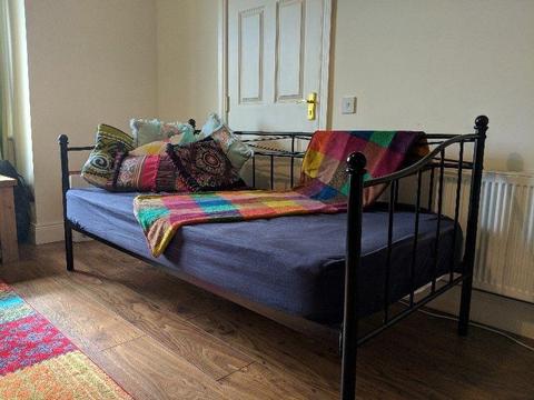 Day bed with mattress and cushions