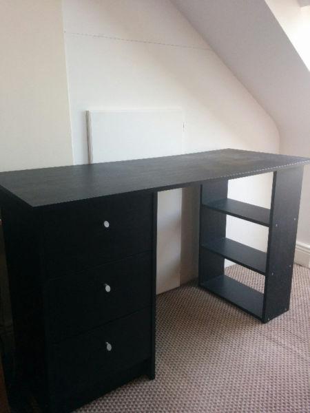 Black desk with drawers and shelves
