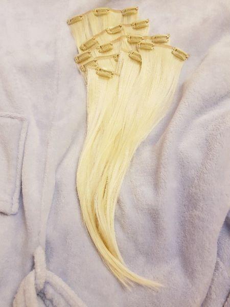 Blonde human hair extensions